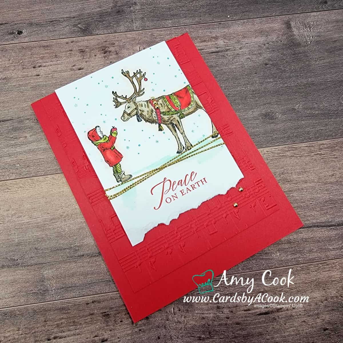 Christmas card featuring a little girl feeding a reindeer